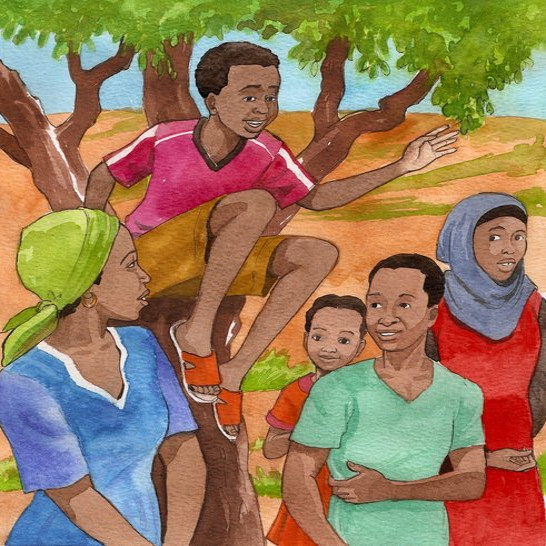 A boy sitting on a tree trunk raising his hand.