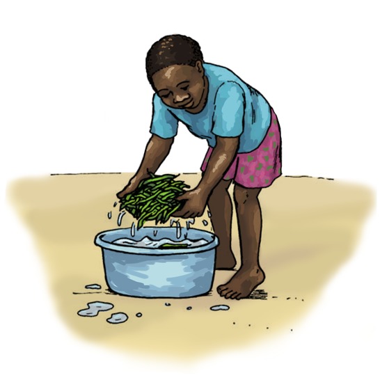 A boy washing beans.