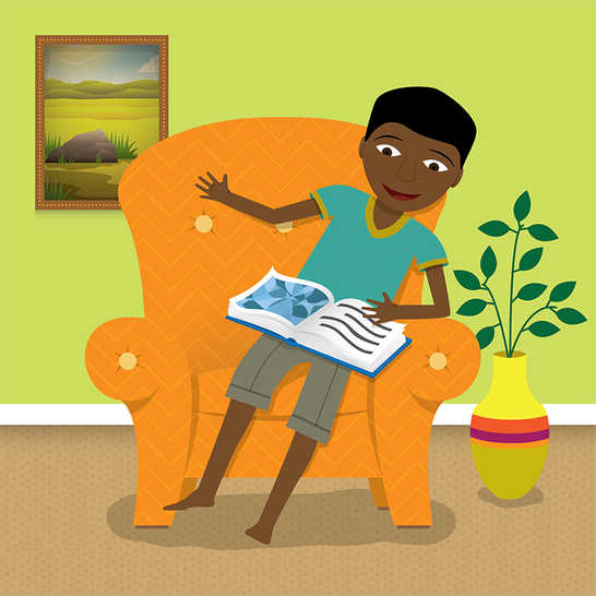 A boy sitting on a chair reading a book.