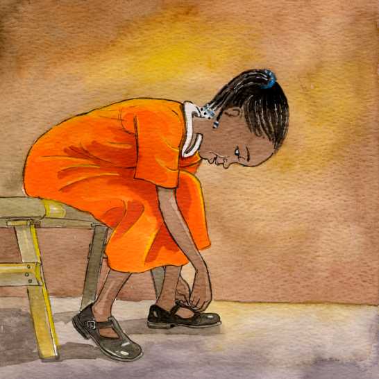 A girl buckling up her shoes.