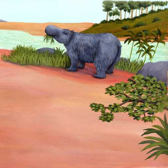 A hippo eating grass by a riverside.