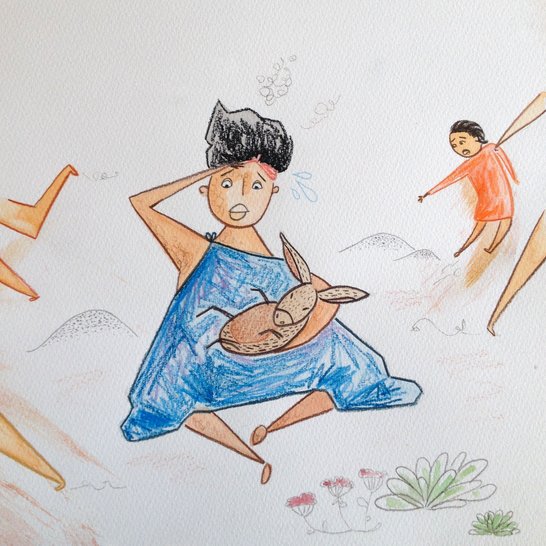 A woman holding a donkey in her arms.