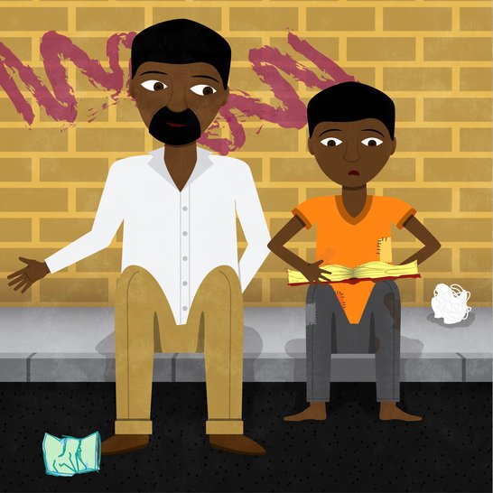 A man sitting next to a boy reading a book on a pavement.