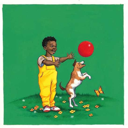 A boy playing ball with a dog.