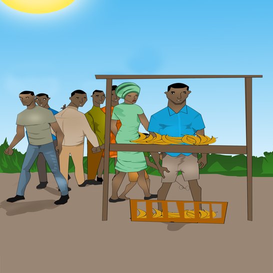 A man standing at a banana stall.