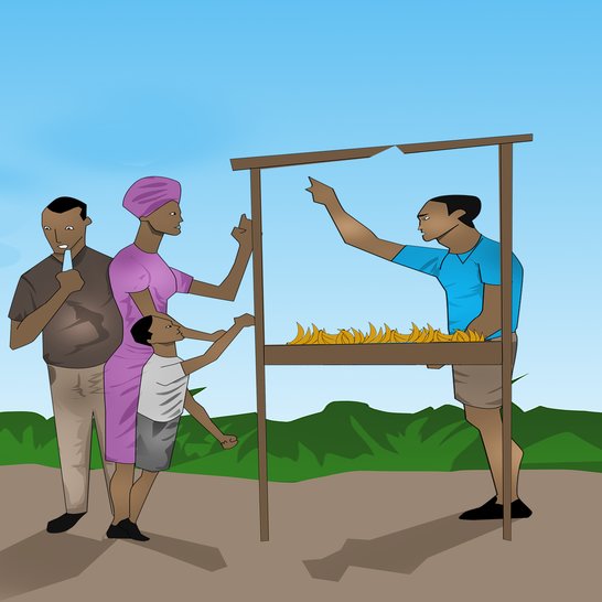 A man standing at a banana stall and people walking towards him.