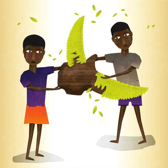 Two boys shaping a lump of melted wax into a bird.